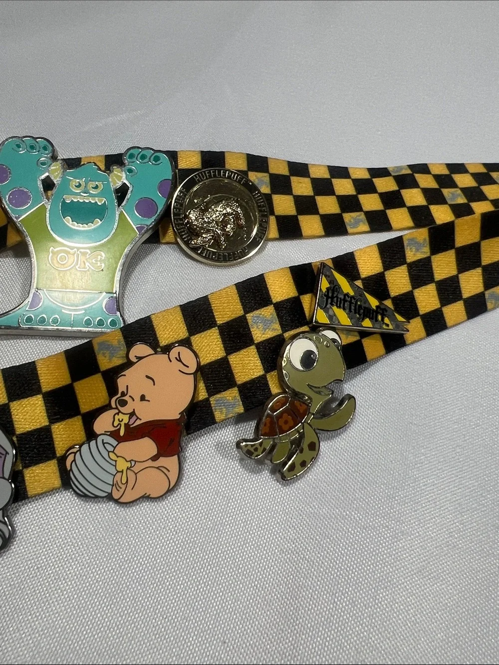 Checkered Universal Studios Harry Potter Lanyard with 16 Character Pins.